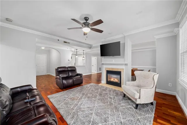 a living room with furniture fireplace and flat screen tv