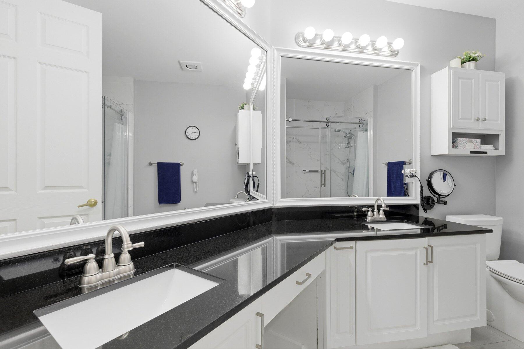 7961 Exeter Boulevard East, Unit 102 Tamarac, FL 33321 - Photo 22 of 46 a kitchen with a sink and cabinets