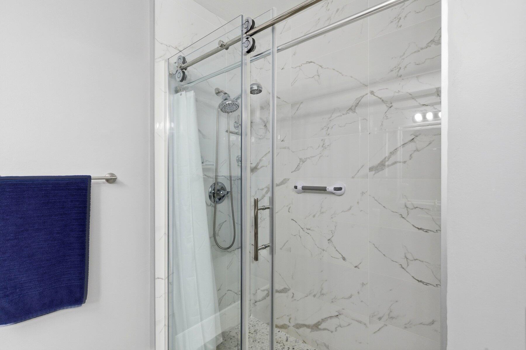 7961 Exeter Boulevard East, Unit 102 Tamarac, FL 33321 - Photo 23 of 46 a bathroom with a shower