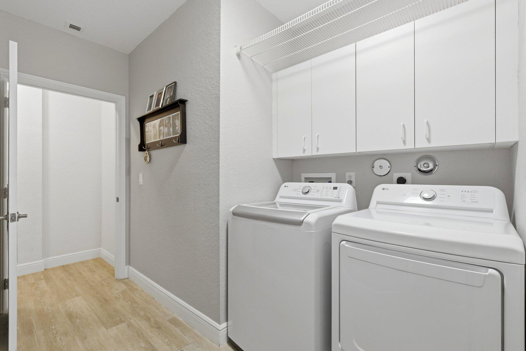 7961 Exeter Boulevard East, Unit 102 Tamarac, FL 33321 - Photo 29 of 46 a view of storage and utility room with washer and dryer