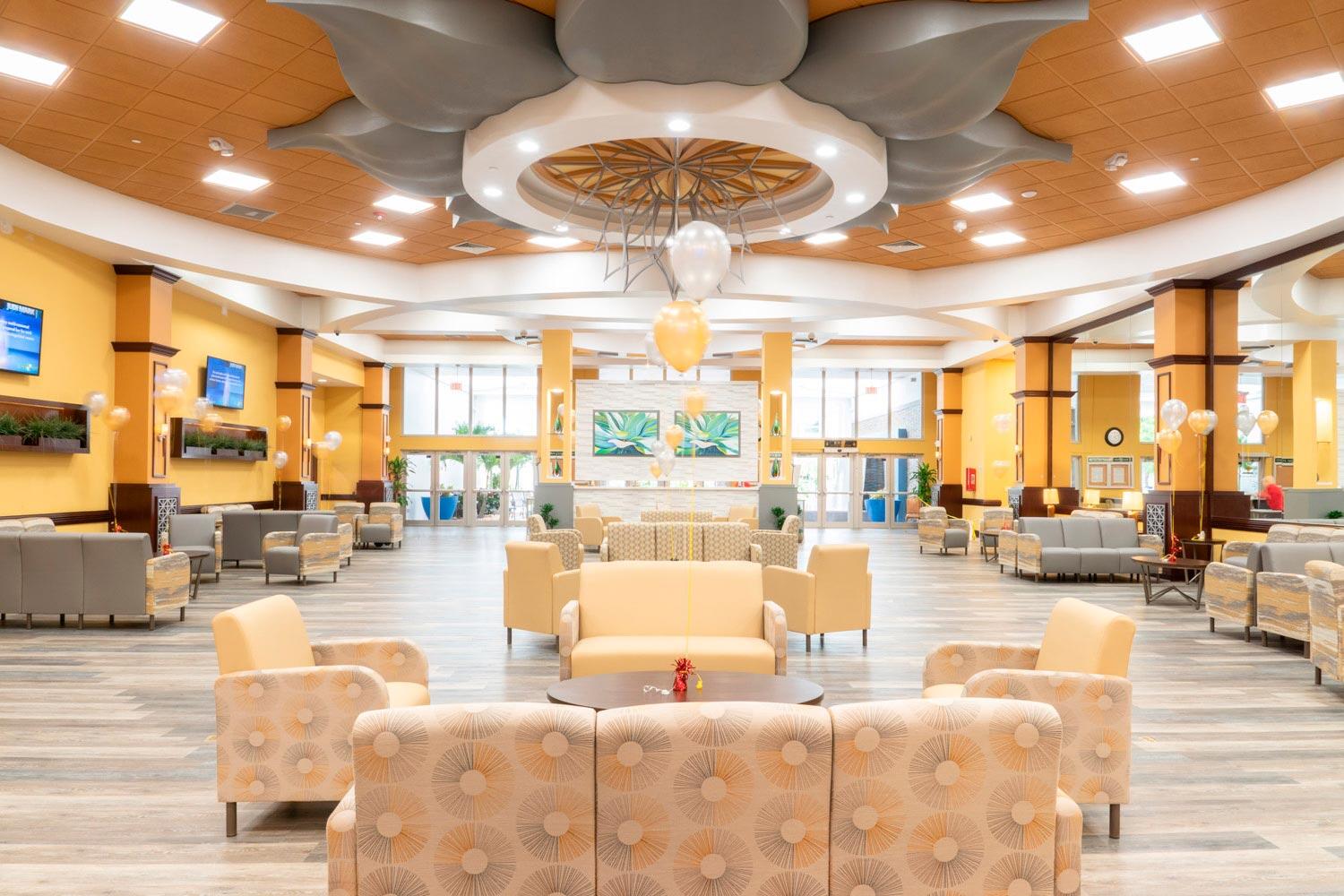 7961 Exeter Boulevard East, Unit 102 Tamarac, FL 33321 - Photo 37 of 46 a living room with furniture and a large window