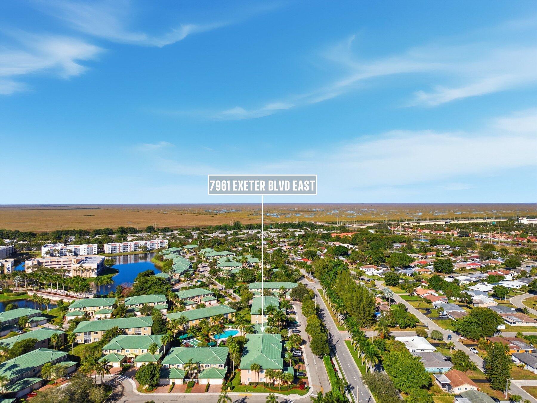 7961 Exeter Boulevard East, Unit 102 Tamarac, FL 33321 - Photo 46 of 46 an aerial view of residential building and car parked