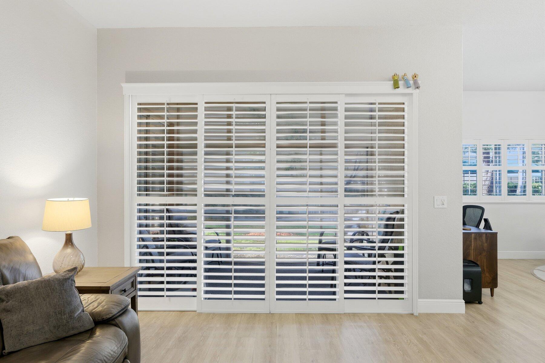 7961 Exeter Boulevard East, Unit 102 Tamarac, FL 33321 - Photo 8 of 46 a view of cabinet with chair and lamp on table