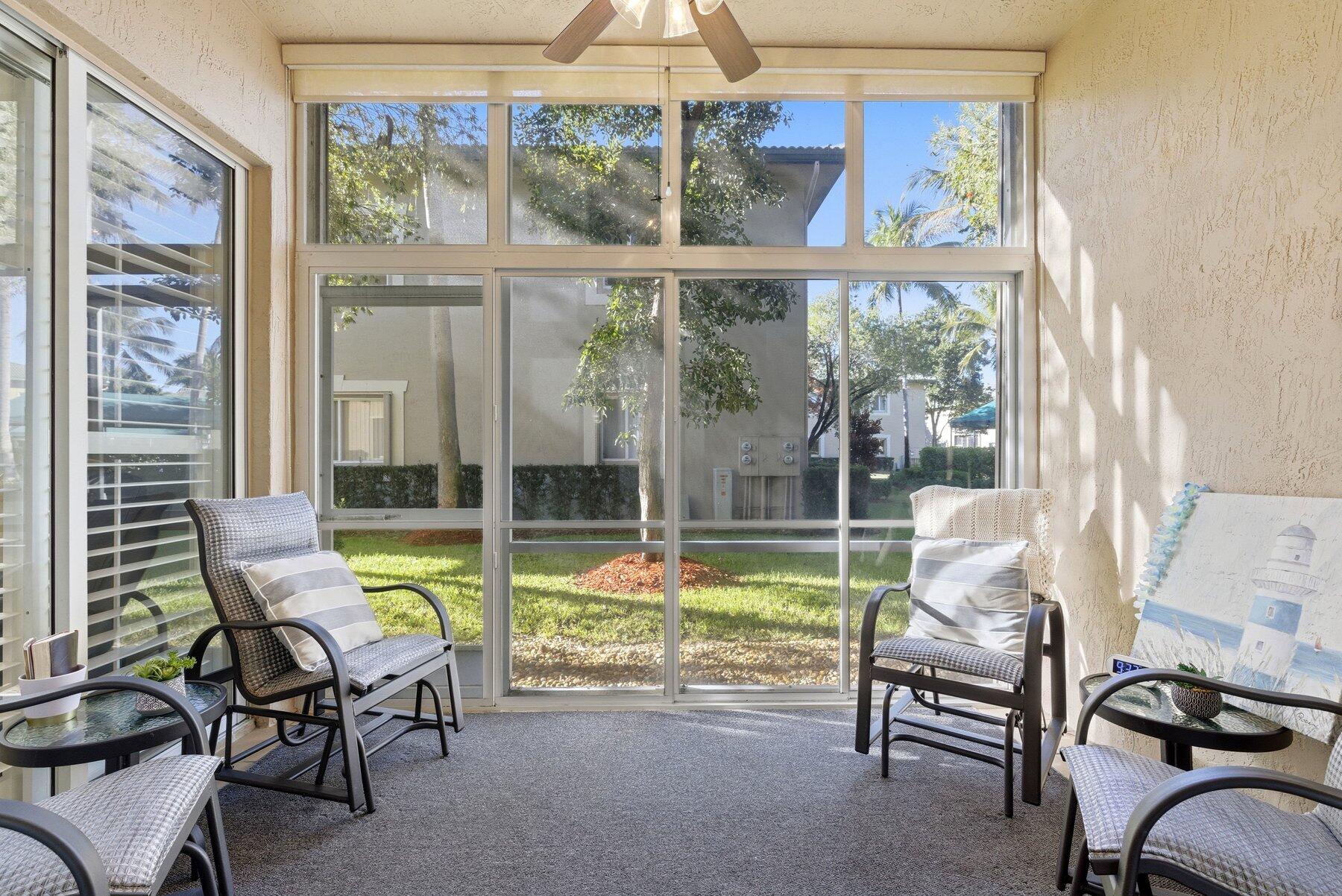 7961 Exeter Boulevard East, Unit 102 Tamarac, FL 33321 - Photo 9 of 46 a view of a living room and dining room