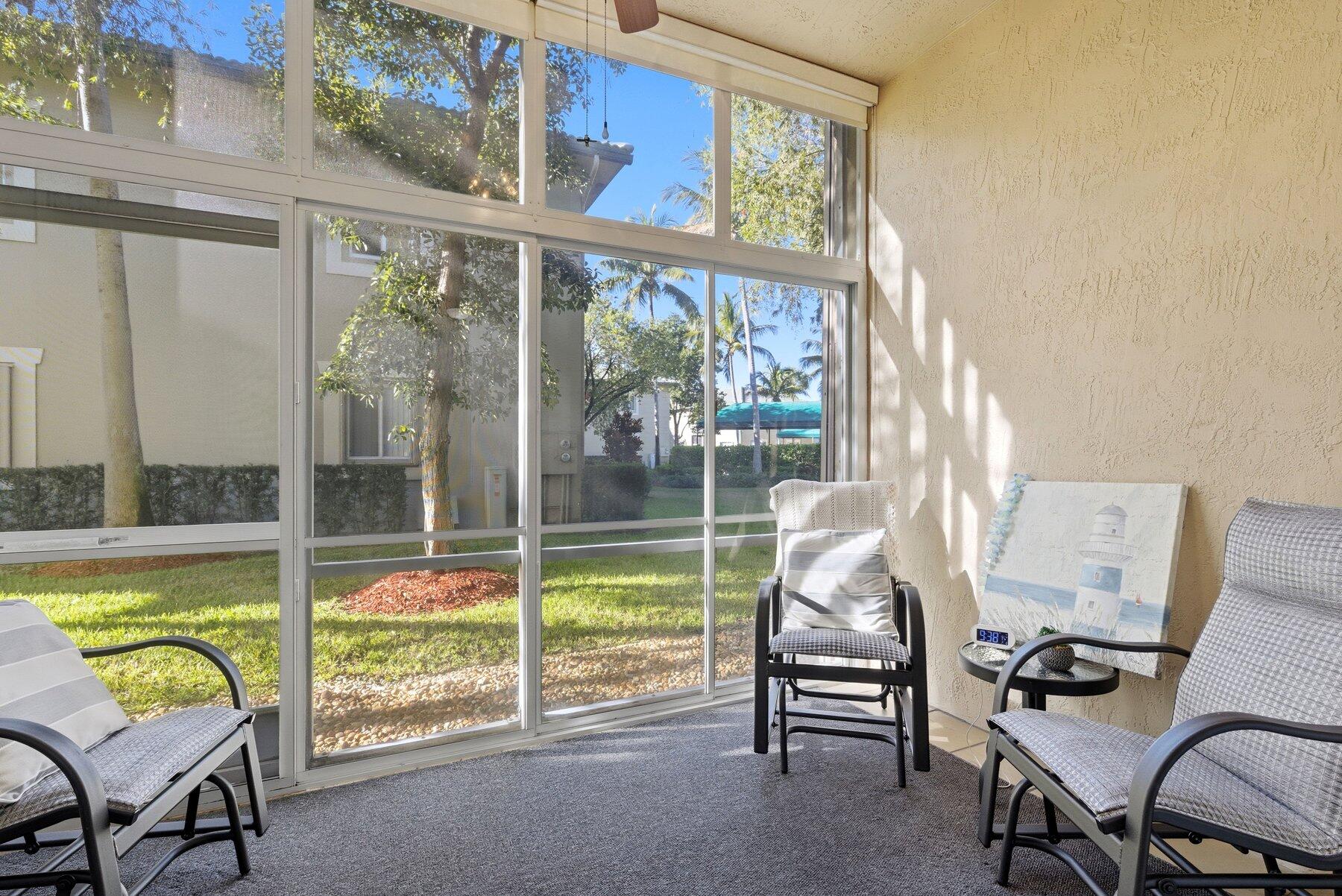 7961 Exeter Boulevard East, Unit 102 Tamarac, FL 33321 - Photo 10 of 46 a living room with furniture and a window