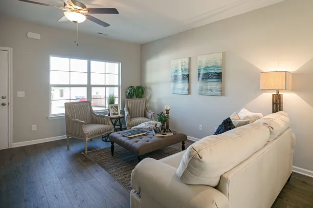 a living room with furniture and a window