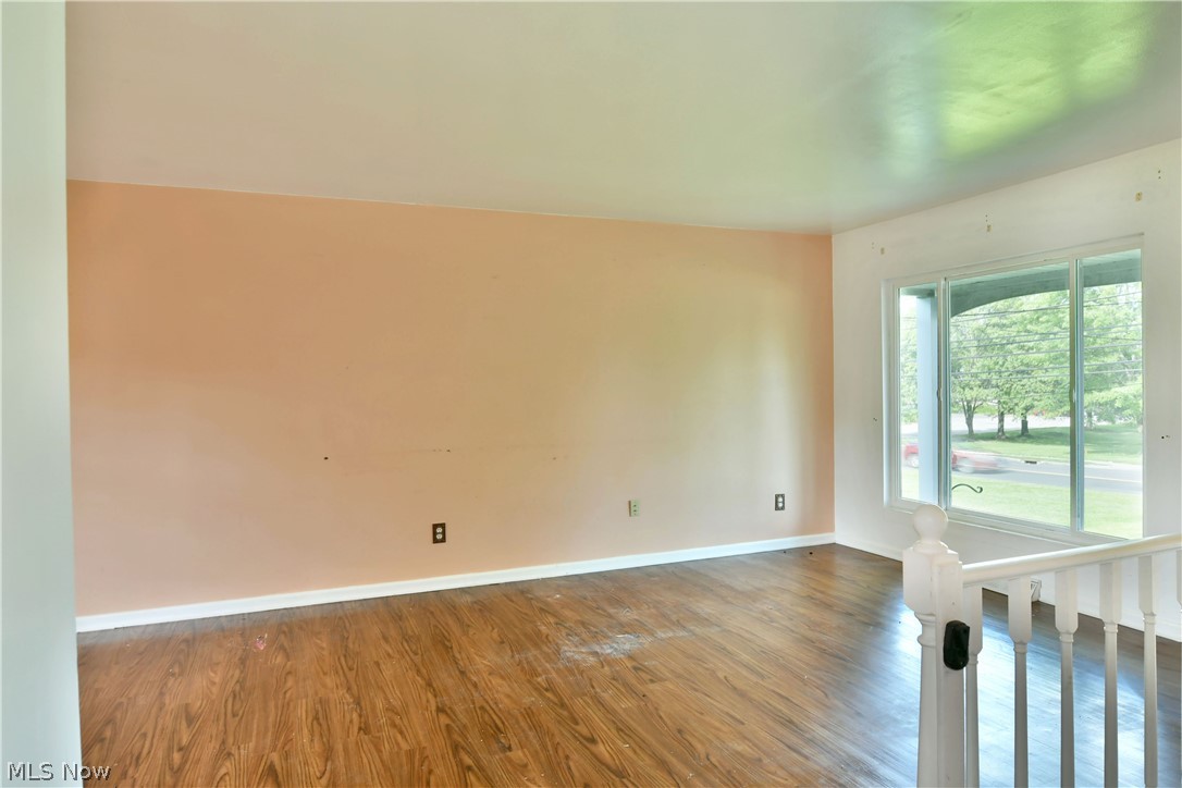 2470 North Road Southeast Warren, OH 44484 - Photo 14 of 35 Spare room featuring hardwood / wood-style flooring