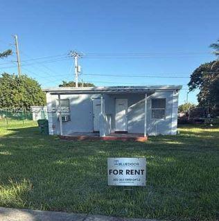 10680 Southwest 172nd Street, Unit 106271 Miami, FL 33157 - Photo 1 of 5 a view of a house with a yard