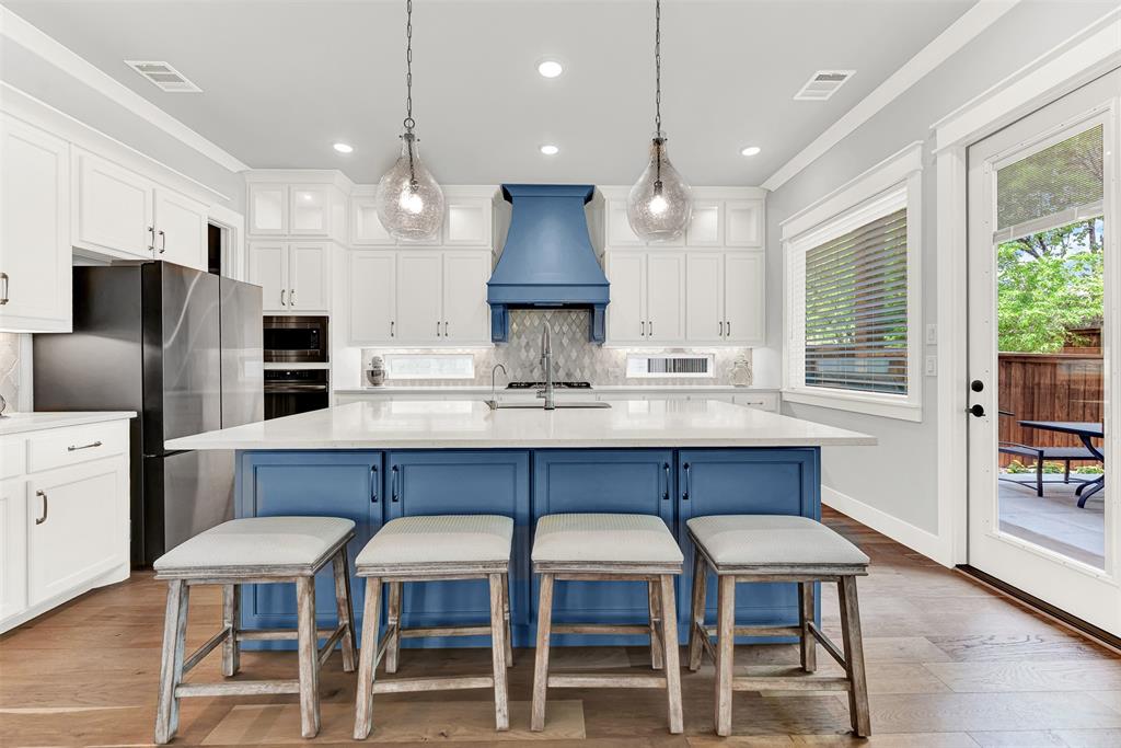 452 Jones Street Grapevine, TX 76051 - Photo 11 of 38 Even the kitchen benefits from sunny windows, and access to the roomy side patio; dining al fresco will be your next favorite thing! Prepare your baking skills for the Frigidaire Pro Series built-in oven and microwave!