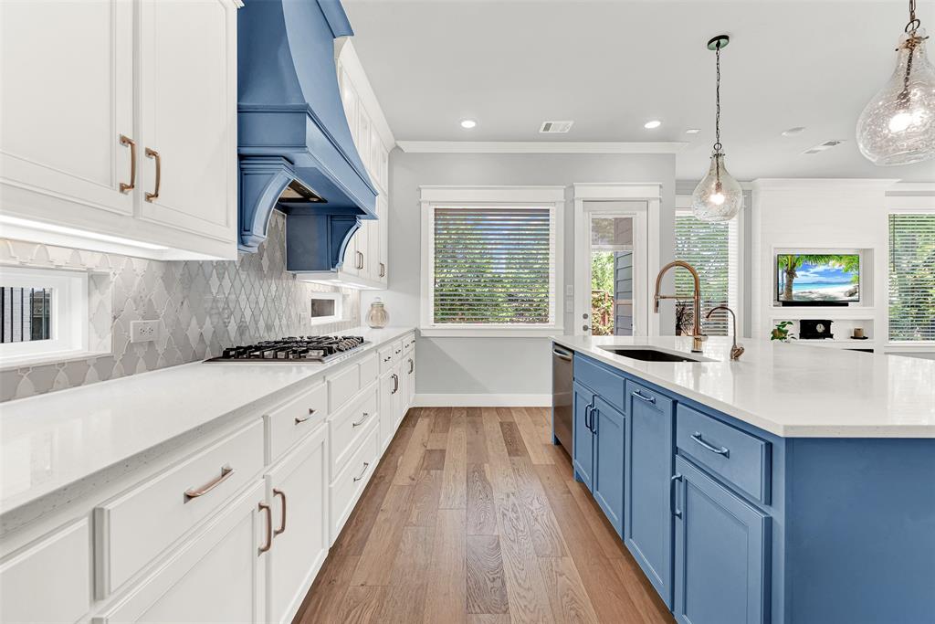 452 Jones Street Grapevine, TX 76051 - Photo 14 of 38 The gourmet kitchen features granite counters, Frigidaire Pro Series gas cooktop and an ERV filtration system