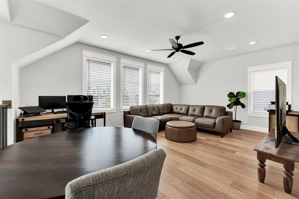 452 Jones Street Grapevine, TX 76051 - Photo 16 of 38 The flex space welcomes you with large sunny windows and a ceiling fan to stay cool when the weather gets warmer.