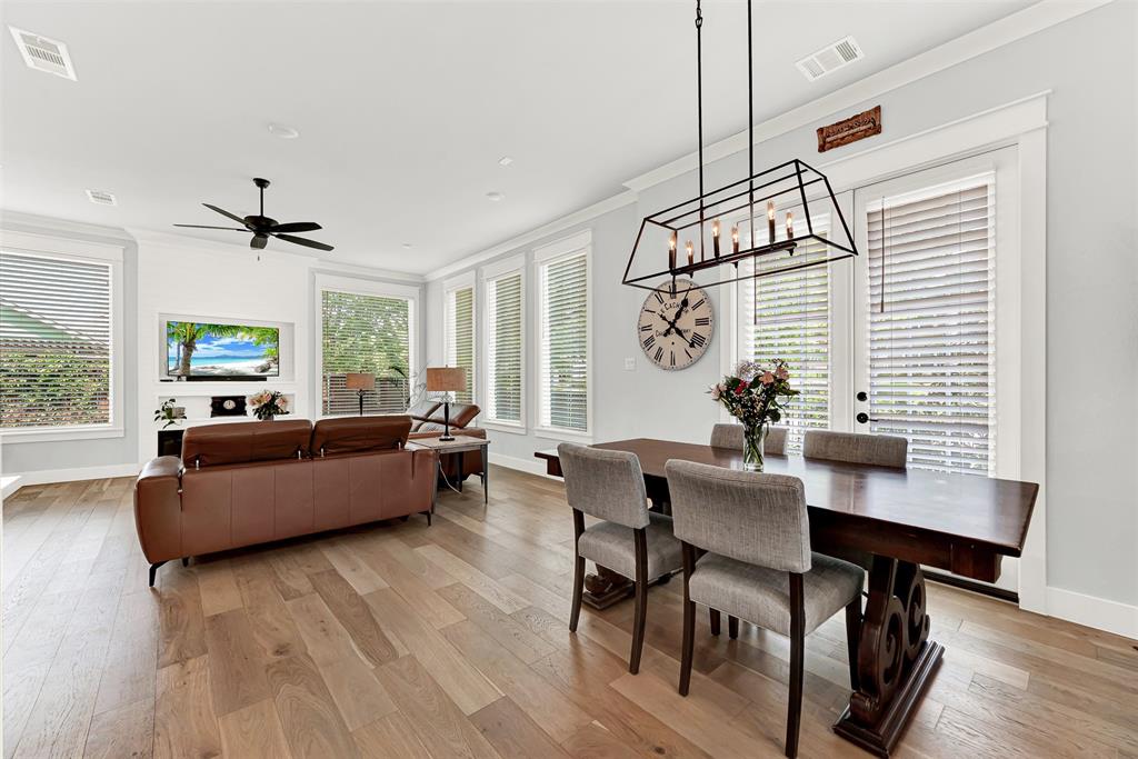 452 Jones Street Grapevine, TX 76051 - Photo 5 of 38 The main room starts with this cozy dining nook under a fabulous decorator chandelier and doors to a recently added side patio!
