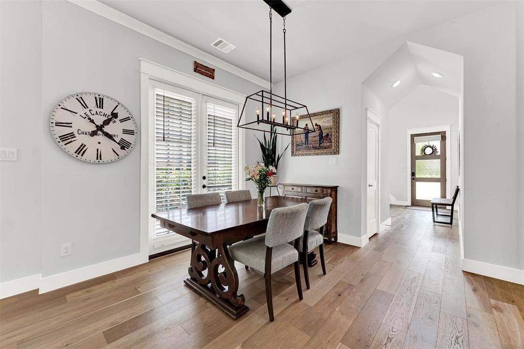 452 Jones Street Grapevine, TX 76051 - Photo 6 of 38 The dining room is tucked into a cozy corner of the room, softly lit from the french doors to the backyard.