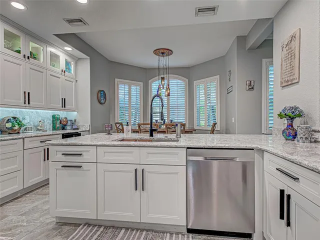 a view of a dining room with furniture and window