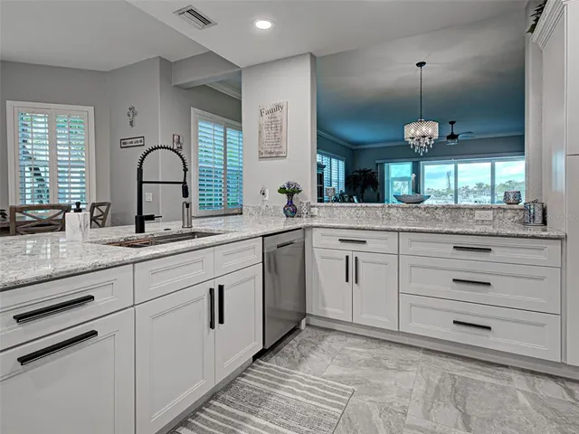 a view of a dining room with furniture and window
