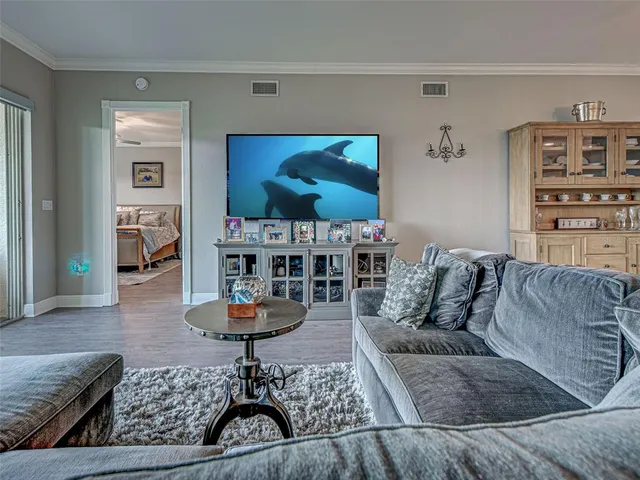 a bathroom with a granite countertop double vanity sink and a mirror