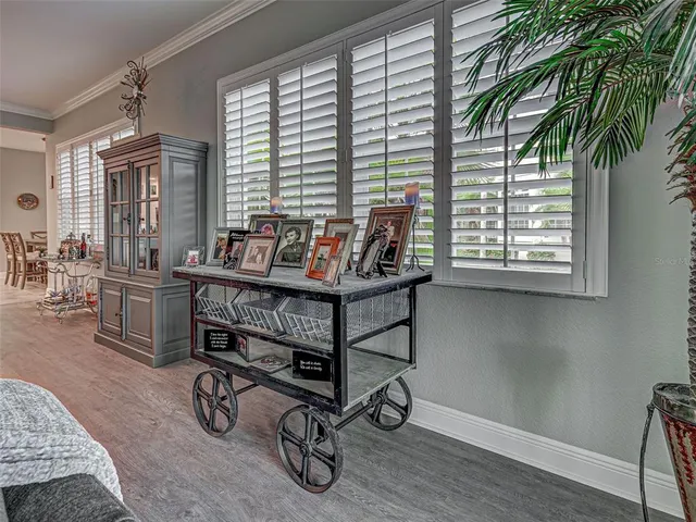 a bathroom with a granite countertop sink a mirror and vanity