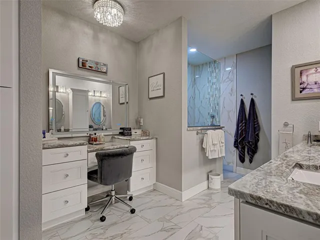 a living room with furniture large windows and a rug
