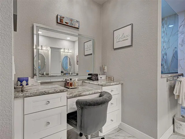 a kitchen with stainless steel appliances granite countertop a sink and a stove