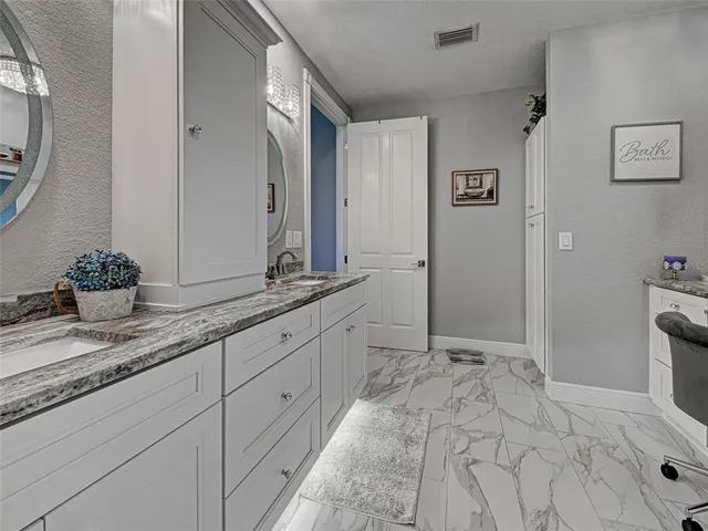a view of a roof deck with couches wooden floor and city view