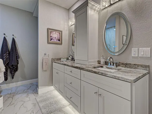 a view of a house with swimming pool and sitting area