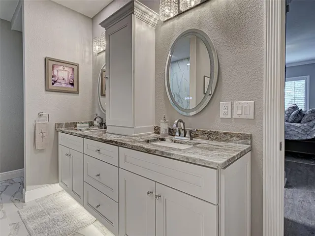 an aerial view of a house with swimming pool patio and outdoor seating