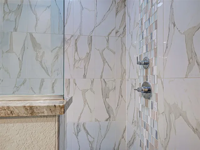 an aerial view of a house with swimming pool patio and outdoor seating