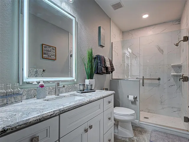 an aerial view of residential houses with outdoor space