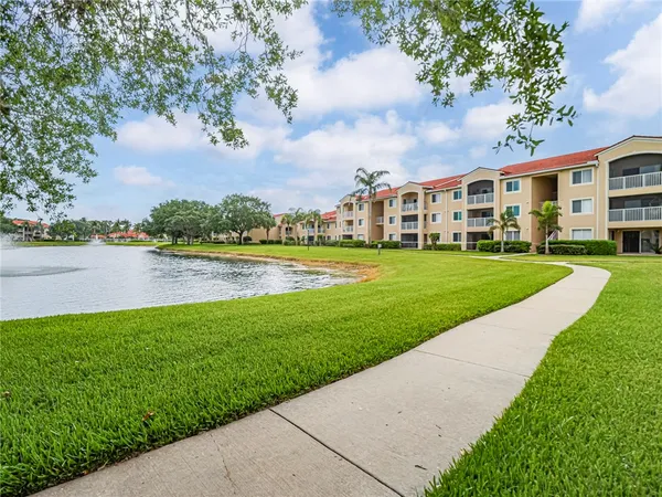 a view of a big yard with a house in the background