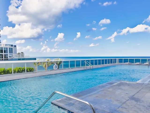 a very nice looking room with lots of furniture and a large window