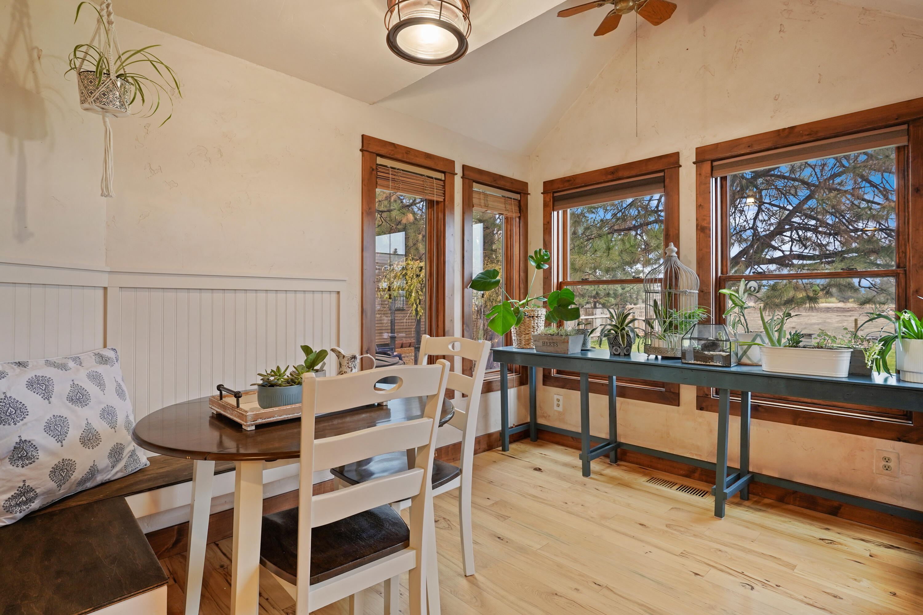 63520 Cricketwood Road Bend, OR 97701 - Photo 22 of 84 a view of a dining room with furniture window and outside view