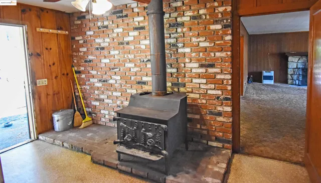 a kitchen with sink stove and cabinets
