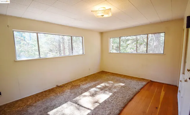 a bathroom with a sink toilet and window