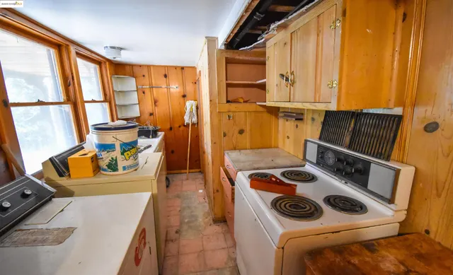 a bedroom with furniture and large windows