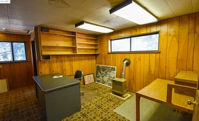 a view of a hallway with paintings on the wall