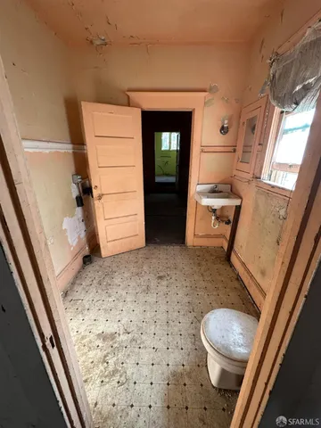 a view of an empty room with windows