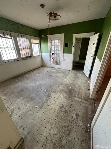 a view of an empty room and a window