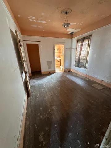 a living room with a couch and a stove top oven