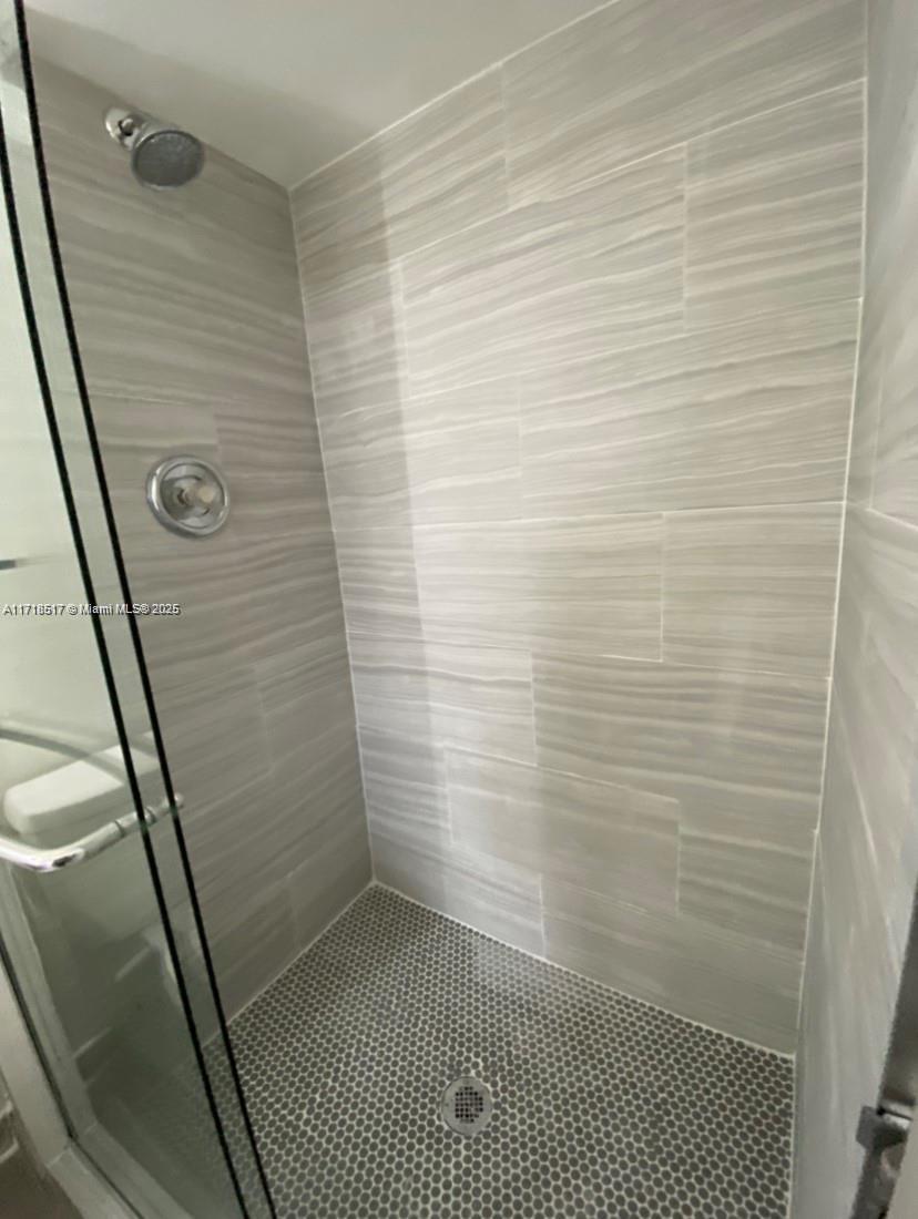 13499 Biscayne Boulevard, Unit 1507 North Miami, FL 33181 - Photo 23 of 34 a bathroom with a shower