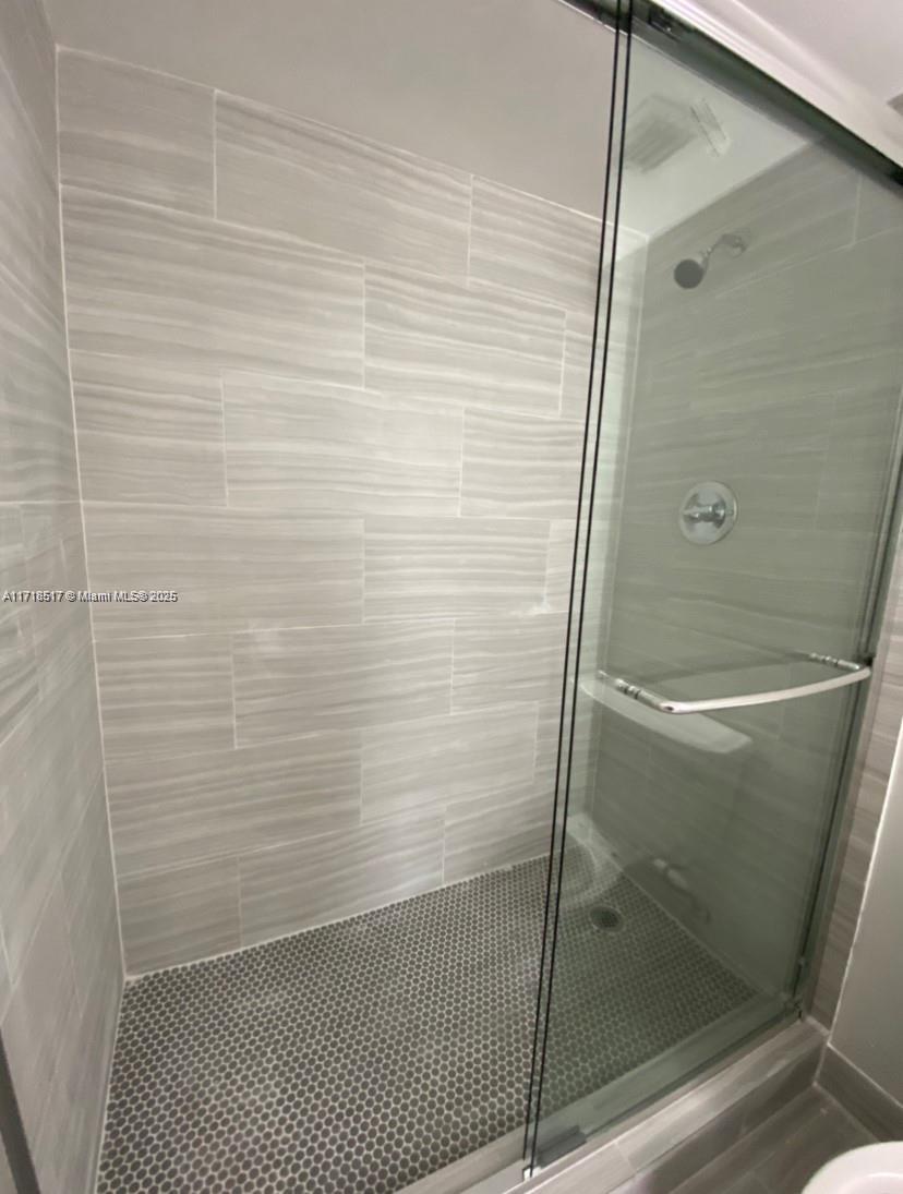 13499 Biscayne Boulevard, Unit 1507 North Miami, FL 33181 - Photo 31 of 34 a bathroom with a shower