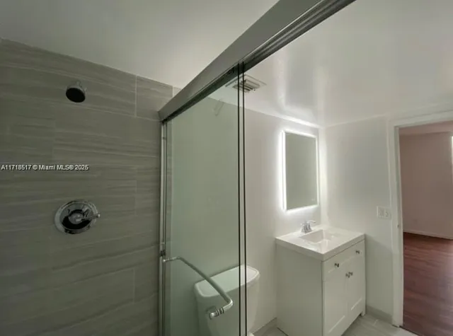 a bathroom with a sink and mirror