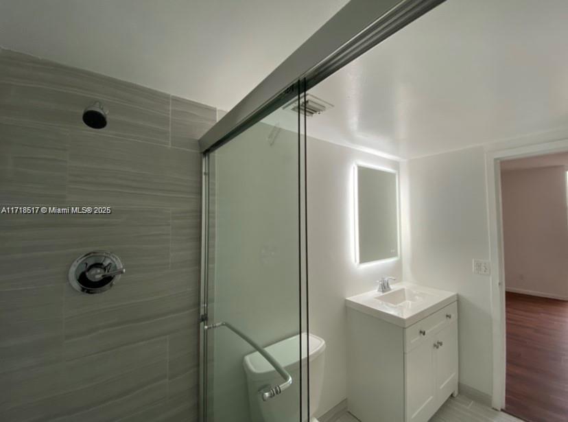 13499 Biscayne Boulevard, Unit 1507 North Miami, FL 33181 - Photo 32 of 34 a bathroom with a sink and mirror