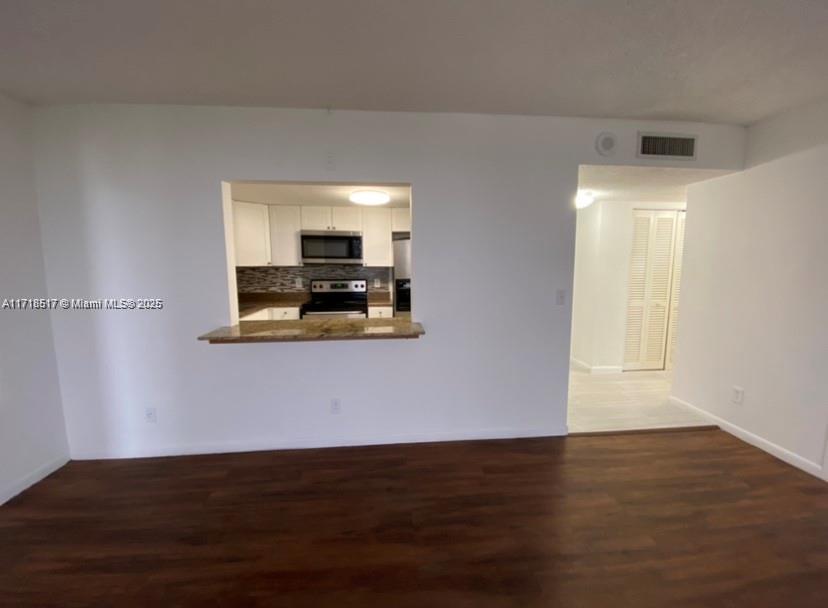 13499 Biscayne Boulevard, Unit 1507 North Miami, FL 33181 - Photo 7 of 34 a view of kitchen and wooden floor