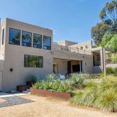 a view of front of house with a yard