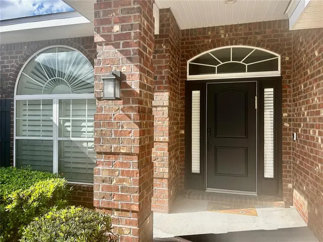 a kitchen with granite countertop a sink and cabinets