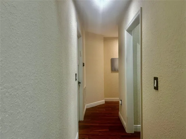 a spacious bedroom with a bed and a window