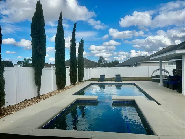 a view of a patio with swimming pool