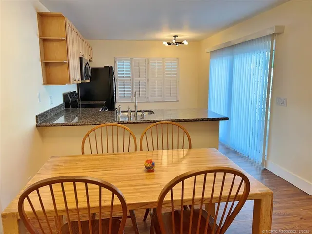 a very nice looking dining room with furniture