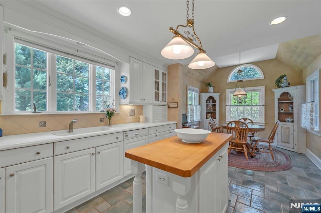 174 Paramus Road Paramus, NJ 07652 - Photo 12 of 45 a view of a kitchen counter space dining table and chairs