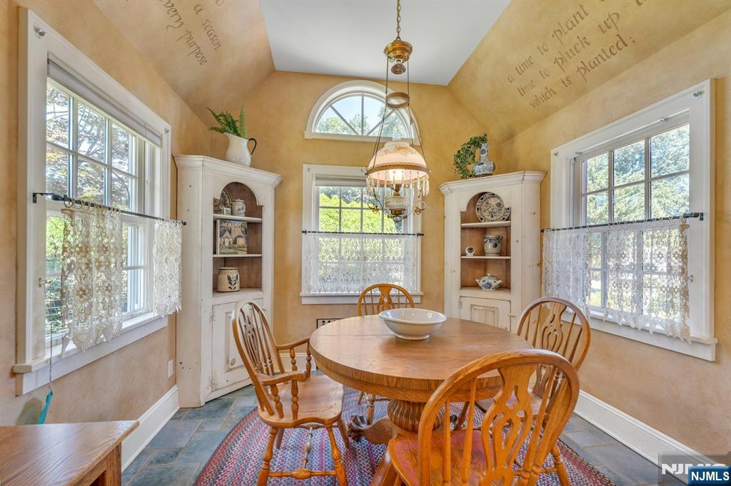 174 Paramus Road Paramus, NJ 07652 - Photo 13 of 45 a view of a dining room with furniture a chandelier and wooden floor